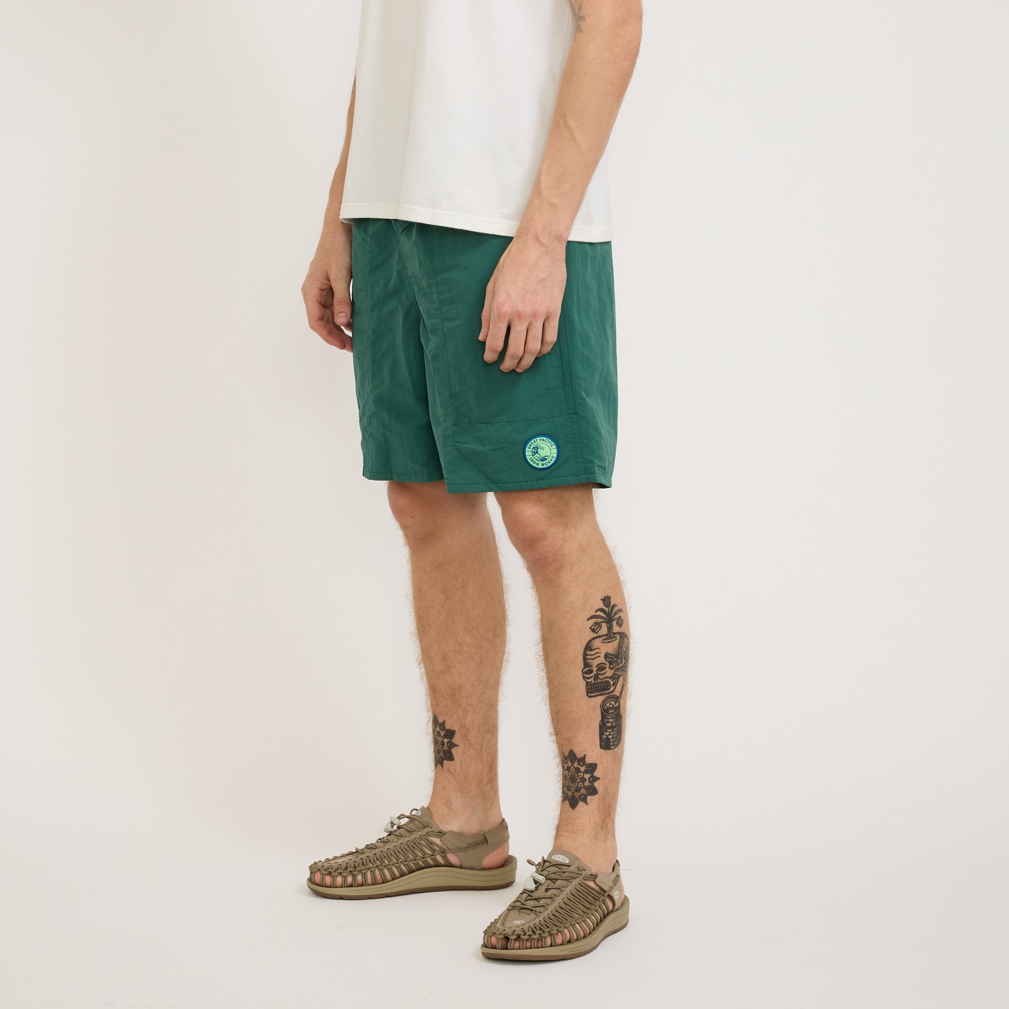 Patagonia | Baggies Longs 7 in. GPIW Crest: Conifer Green | Maplestore