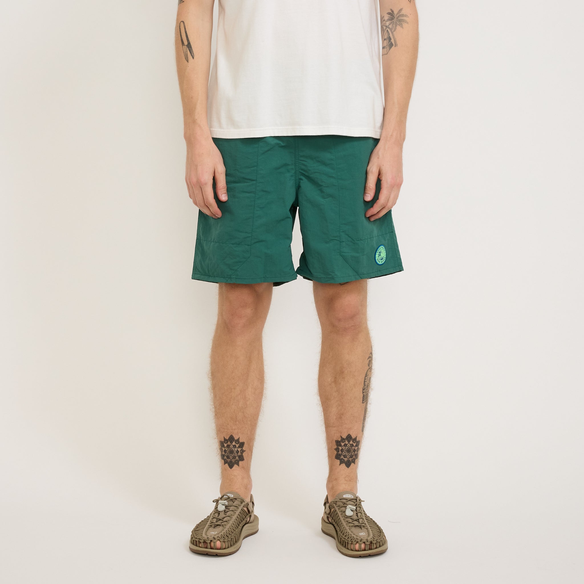 Patagonia | Baggies Longs 7 in. GPIW Crest: Conifer Green | Maplestore