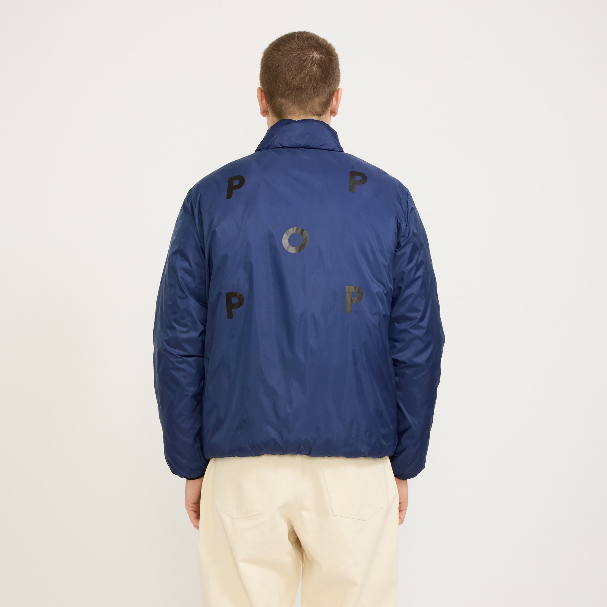 Pop Trading Company | Quilted Reversible Jacket Black/Twilight Blue | Maplestore