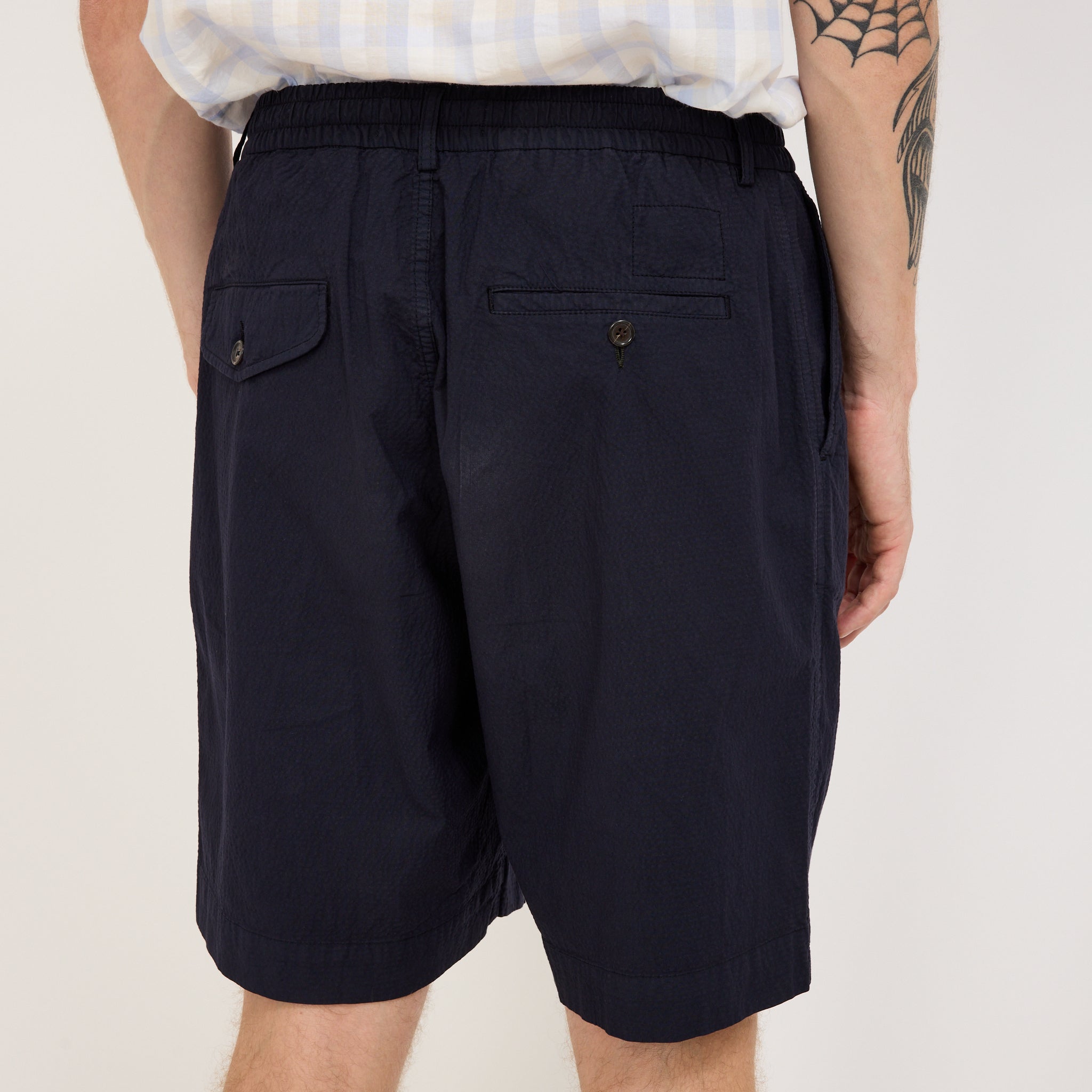 Universal Works | Pleated Track Short Seersucker II Navy | Maplestore